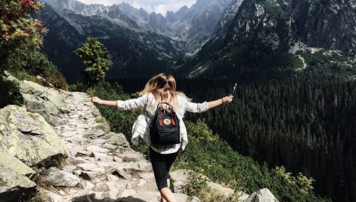 Adventure Girl Standing on the Rock